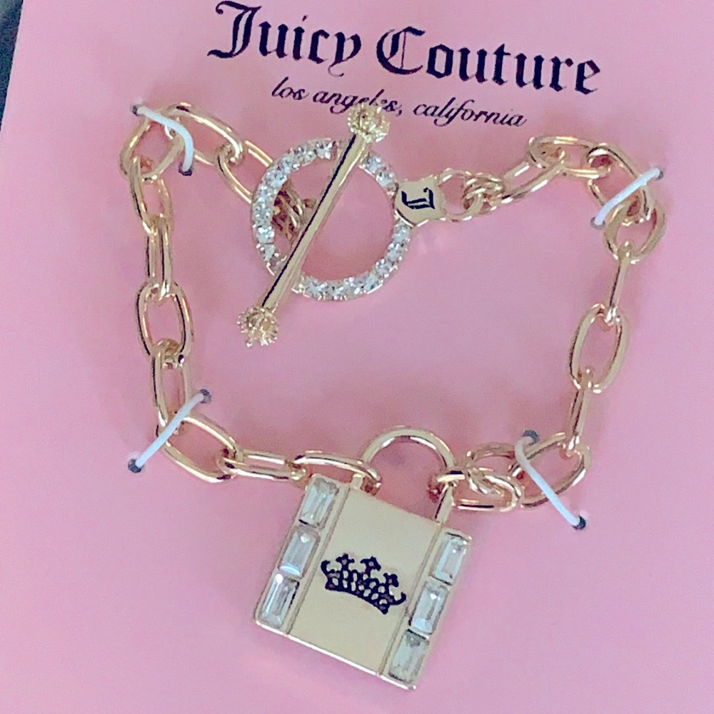 Juicy Couture new gold tone link bracelet with lock and rhinestones.